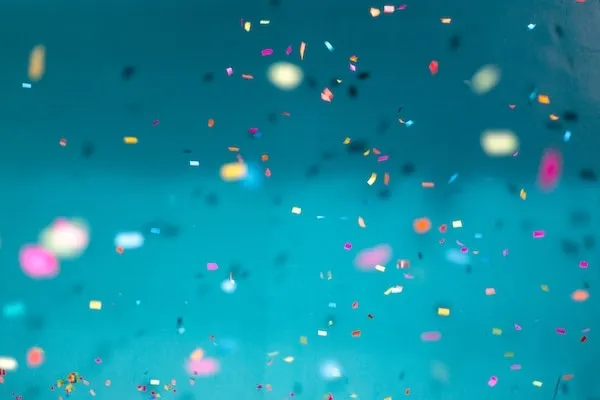 Lots of confetti with a blurred blue background